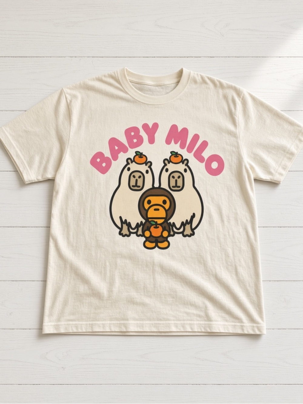 Gildan Cream Graphic Tee with Pink BABY MILO Logo